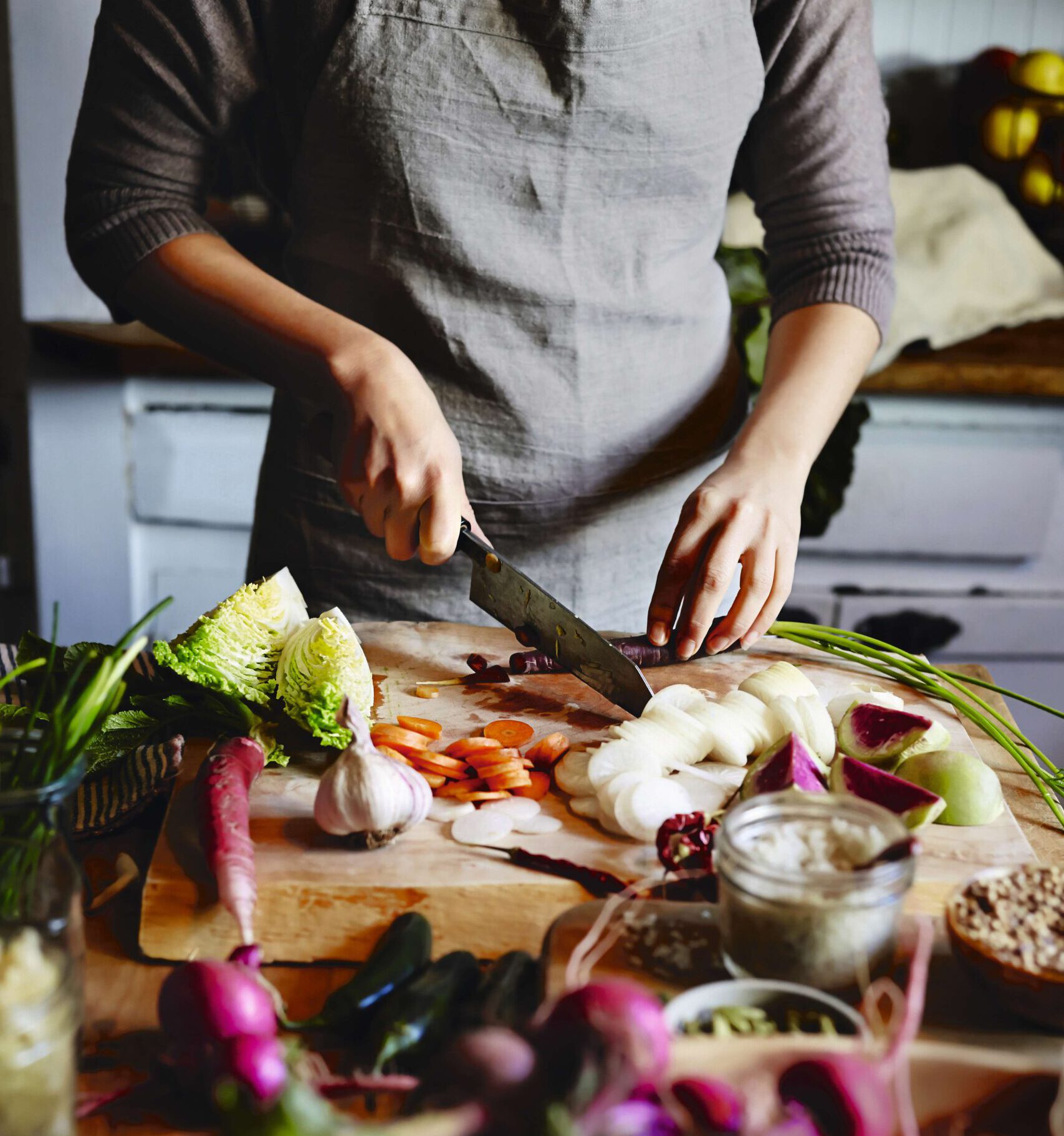 GettyImages-459151487_BEA_uncoated Fresh vegetables are gently prepared and cut on a wooden board